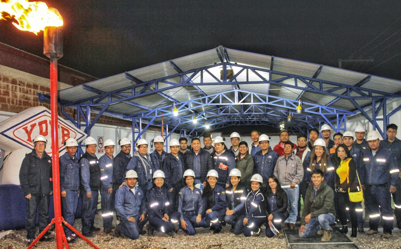 Israel Mamani Sanabria with the legal and operations team at a YPFB gas project site